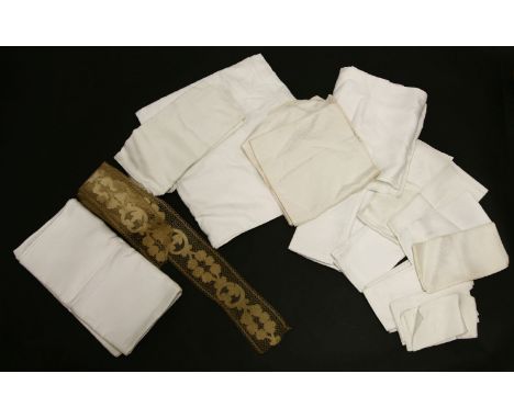 A collection of vintage linens,to include several linen damask tablecloths, linen napkins of various designs and a roll of cr