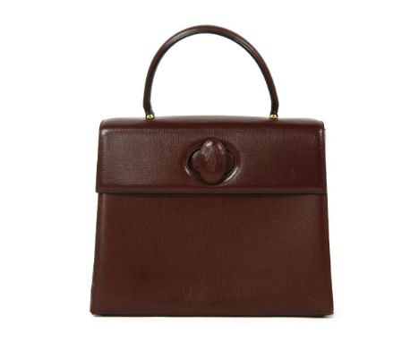 A Cartier red bordeaux leather Kelly-style tote handbag,with twist monogrammed lock, pockets to interior, stamped 'Cartier Pa