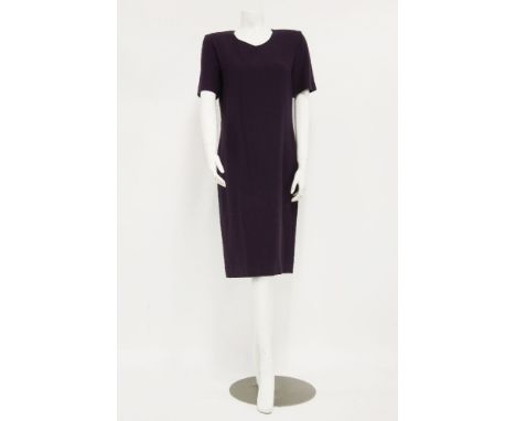 A collection of vintage textiles to include:a Valentino navy dress with bow detail to front, an Yves Saint Laurent green jack