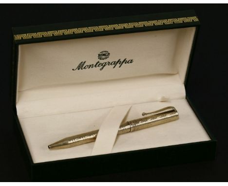 A sterling silver Montegrappa ballpen,with engine turned wavy line decoration, import hallmark, London, 1995, with Italian as