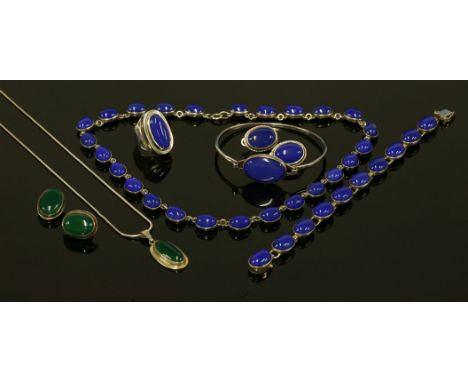 A sterling silver stained blue agate matched necklace, bracelet, ring, bangle and earring suite,c.1920, the necklace and brac