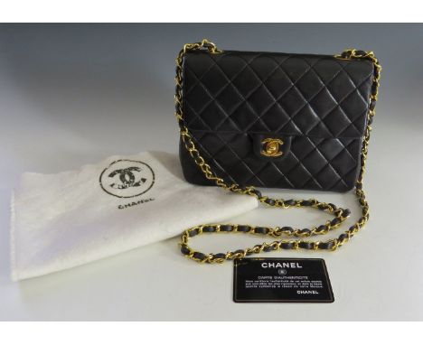 A Chanel vintage black quilted lambskin medium flap shoulder bag,with 'CC' twist lock to the front, serial number 1381892, wi