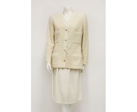 A Chanel cream bouclé wool tweed jacket, with white wool collar and detailing to pockets,together with a Christian Dior cream