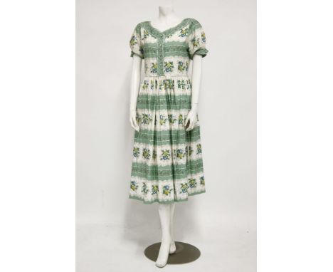 A collection of vintage dresses,to include:an F M White cotton tea dress, c.1950-1960, with printed green and floral pattern,