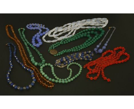 Assorted bead necklaces,to include:a three-row milk glass oval bead necklace,an Art Deco three-row graduated green glass bead