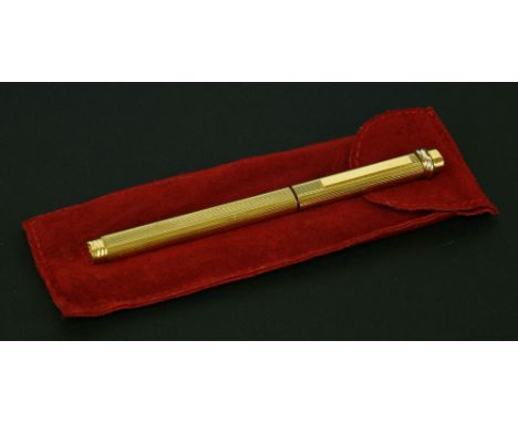 A Cartier gold-plated Vendome ball pen,with reeded 'Godron' decoration, suede pouch, no box or papers