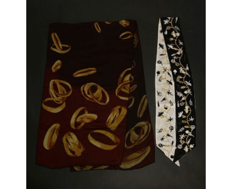 A Cartier silk scarf,red burgundy ground with a printed 'ring' design,42 x 154cm, together with a Cartier silk head scarf,bla