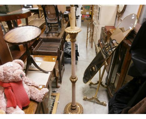 A gilt and velvet standard lamp