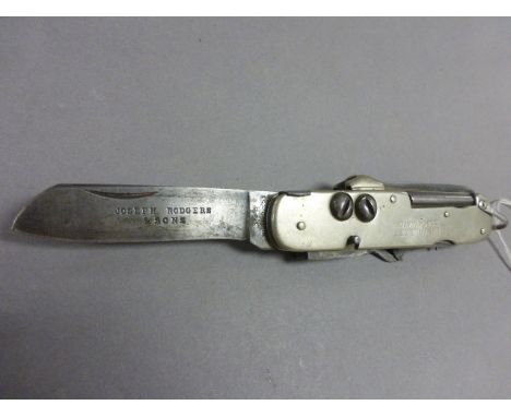 A Joseph Rodgers & Sons white metal Swiss Army knife; bearing engraving for L. H. Willett, Black Watch; 11cm long