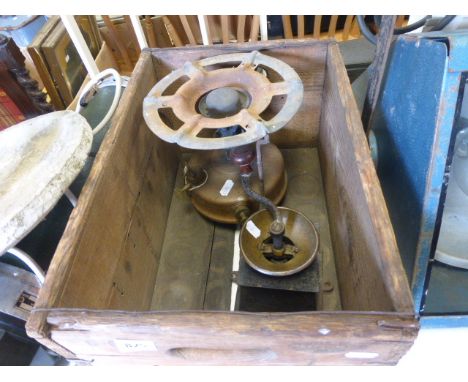 A vintage coffee grinder and a vintage heater in wooden box