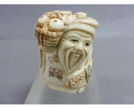 Signed oxbone netsuke of an Old Man with basket