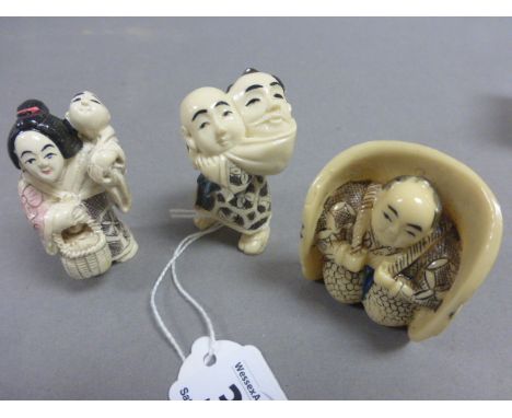 Three netsuke type carvings to incude seated man, man carrying another in sack and woman with child