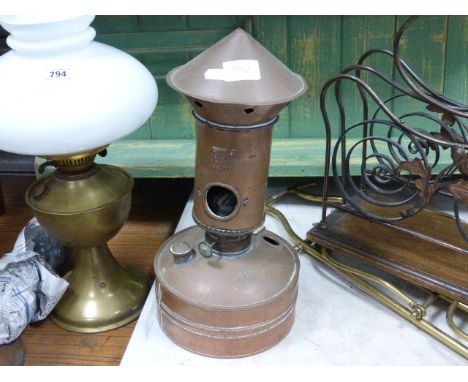 An interesting design copper oil lamp; manufactured by Hotlite