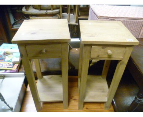 A pair of square pine single drawer side tables raised on square supports; with shelf below