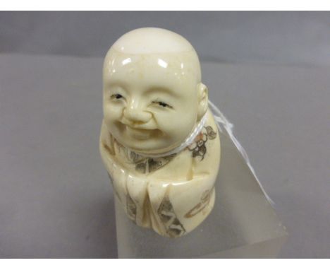Oxbone netsuke of a Boy Buddha