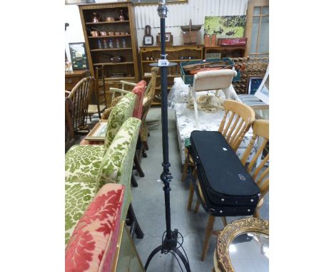 A ironwork scroll standard electric standard lamp