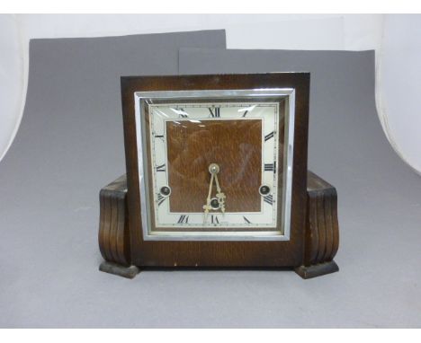 An Art Deco oak cased mantle clock