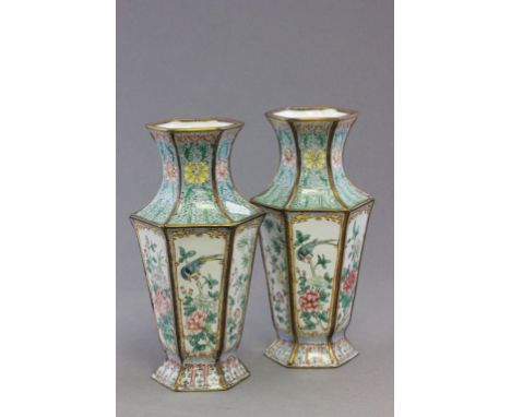 A pair of Chinese Canton enamel hexagonal vases, decorated with panels of birds and flowers, 23cm high