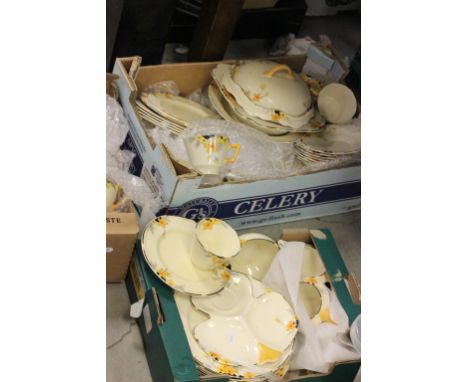 A extensive Crown Ducal dinner and tea service; decorated with orange and yellow blossom
