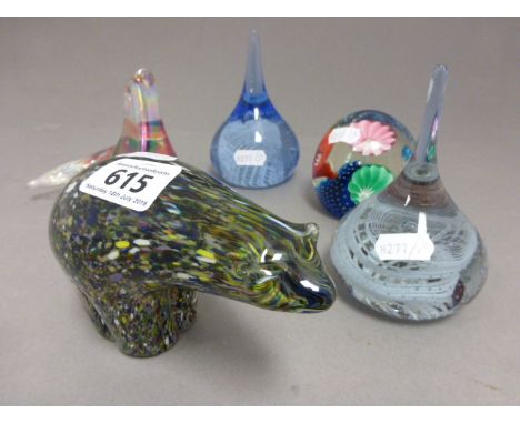 A group of five glass paperweights; comprising to Caithness style paperweights; a seal, a polar bear and a floral paperweight