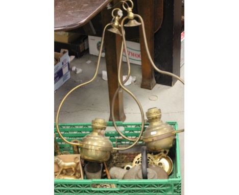 A box of various copper and brass to include hanging oil lamp fittings; and a quantity horse brasses