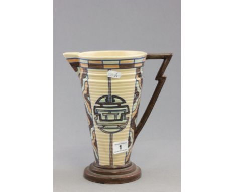 A 1930s Royal Cauldron ribbed pottery jug, in the manner of Charlotte Rhead, with stylised handle