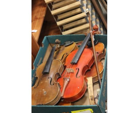 A box of five violins; all in need of restoration; together with a double bass bow; also in need of restoration