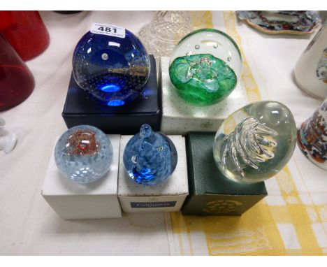 A collection of five boxed Caithness and other paperweights