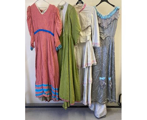4 vintage theatre company period style costumes, 3 dresses and a 2 piece outfit. In varying colours and styles. 