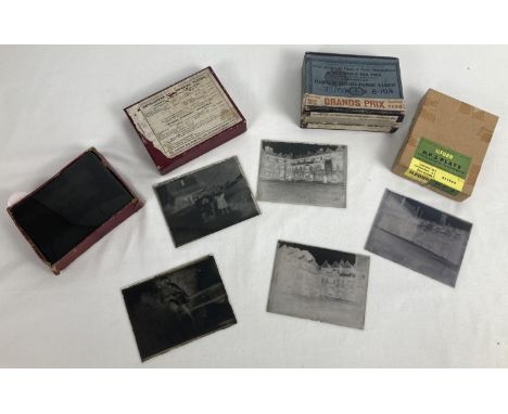 A small collection of assorted vintage glass photographic slides. 
