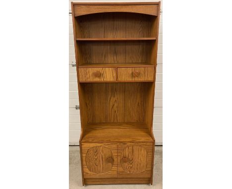 A retro 1970's oak effect wall unit with 2 shelves, 2 drawers and a double cupboard to base with interior shelf. Large round 