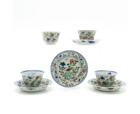 China, 4 sets of cups and saucers, Kangxi, 13 cm. in diameter, chip and hairline. 
