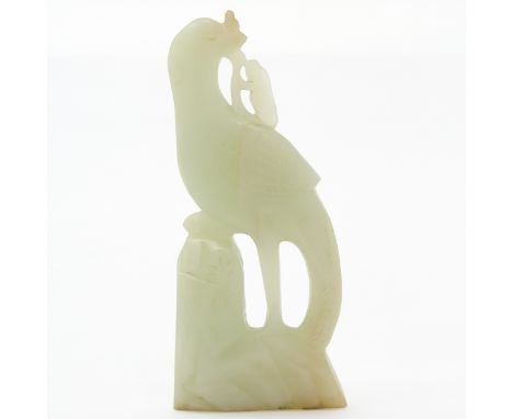 China, carved jade, depicting a bird, 12 cm. tall. 