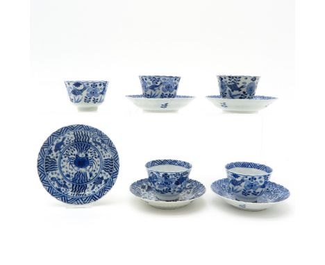 5 cups and saucers, blue and white decor marked with double ring and 4 characters, saucers are 13 cm. in diameter, chip and h