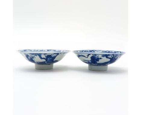 China, 2 Kangxi water bowls, blue and white decor, marked with double ring on the bottom, 18 cm. in diameter, chip.