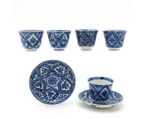 Including 5 cups and 2 saucers, blue and white decor, marked on the bottom, 14 cm. in diameter, restored. 