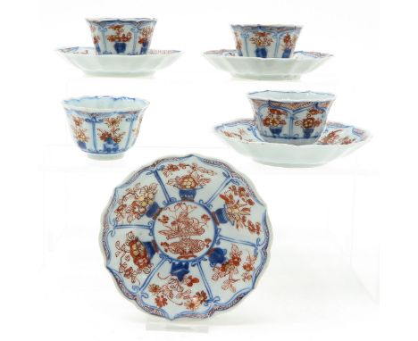 Including 4 cups and saucers, Imari decor, 10 cm. in diameter, hairline.