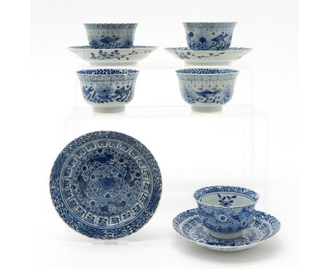 Including 5 cups and 4 saucers, blue and white decor, marked with double ring and 4 characters, 13 cm. in diameter, chip and 