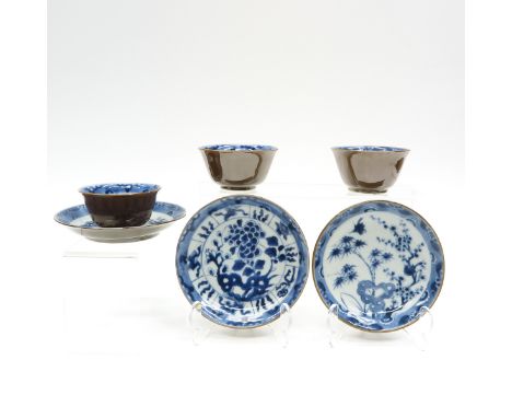 China, including 3 cups and 3 saucers with cappuccino decor and blue and white interior, saucers are 14 cm. in diameter chip 