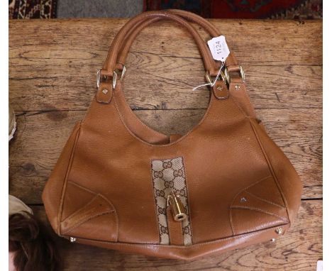 Gucci Jackie Hobo Bag, with GG monogrammed trim, gilt-tone hardware, slip lock, brown cotton lining, zipped pocket, leather G