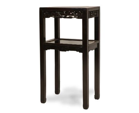 A Chinese Hardwood Two-Tier Plant Stand, Qing Dynasty, circa 1900, of rectangular form, the stylised and foliate-carved friez