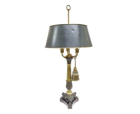 A French Gilt and Patinated Bronze Three-Light Table Lamp, in Empire style, with loop finial over a rise-and-fall shade on ac