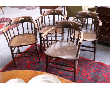 A Set of Four High Wycombe Elm Horse Shoe Backed Chairs, with turned upright legs and stretchers, each stamped K.+.CONOne wit