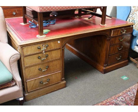 A Victorin Mahogany Red Leather Inset Partners Desk, the locks stamped Hobbs &amp; Co., 183cm by 122cm by 77cmLeather top in 