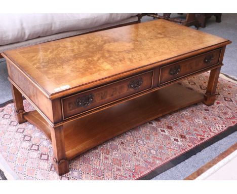 A 20th Century Feather and Crossbanded Burr Walnut Two Drawer Coffee Table, with shaped shelf stretcher, 122cm by 61cm by 46c