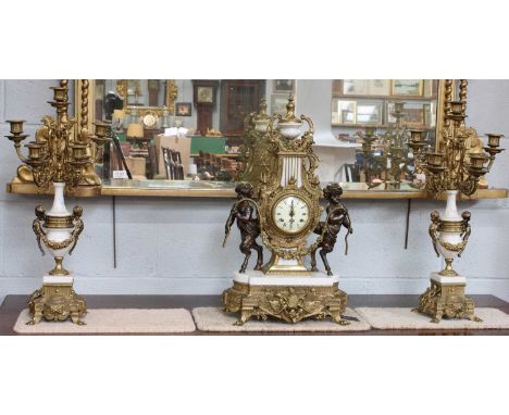 A Modern Imperial Striking Mantel Clock Garniture, clock 62cm high, garniture 61cm highClock white marble base with minor chi