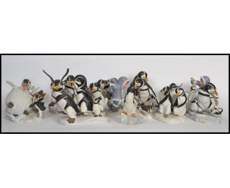A large collection of Franklin Mint Christmas related penguin ceramic figurines to include ' We Four ','&nbsp; Which Way! ', 
