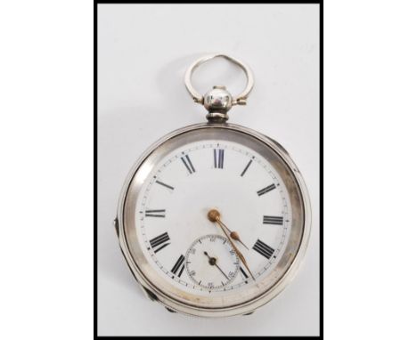 A 19th century Victorian silver hallmarked pocket watch and silver albert chain set to a scratch built wooden pocket watch st