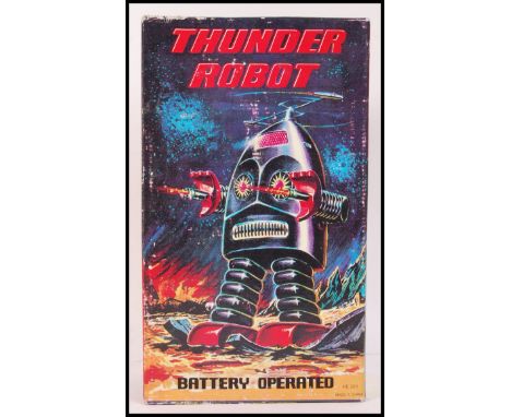 A 20th century ' Thunder Robot ' vintage style tin plate mechanical clockwork toy within the original box. In working conditi