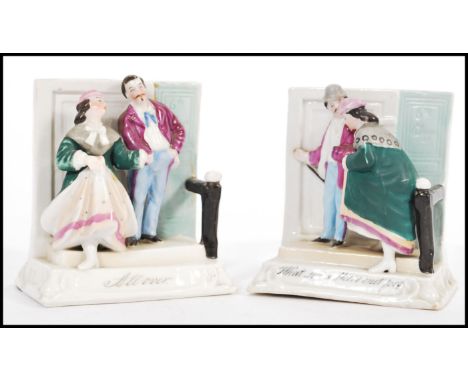 A pair of 19th Century Staffordshire Victorian novelty ceramic fairings / figurines to include one reading 'What have these m